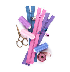 Set of colorful zippers and sewing supplies on white background © Pixel-Shot