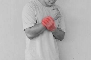 The man wrist pain mark red color black and white color, broken bone human injury hand. Health and care concept