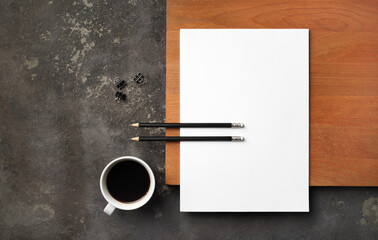 Obraz na płótnie Canvas Blank letterhead, pencils, coffee cup and clips. Responsive design template. Flat lay.