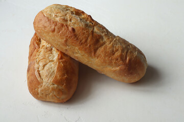golden loaf in flour on the table,close-up, rich bread Selective focus.bread on a white background
