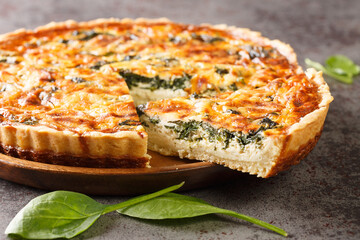 Florentine quiche with spinach and custard egg close-up on the table. horizontal