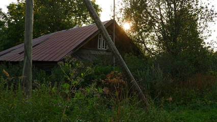Fototapeta na wymiar Beautiful rustic summer landscape. Old wooden log houses. Vologda region