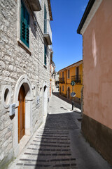 A narrow street between the old houses of Morcone, a village in the province of Benevento, Italy.