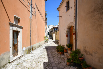 Fototapeta na wymiar A narrow street between the old houses of Morcone, a village in the province of Benevento, Italy.