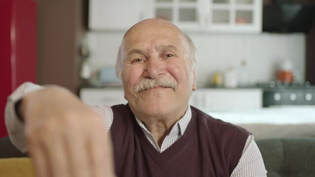 Portrait of human hand showing to camera. Hand kissing.The old man who extends her hand to kiss her visitors during the feast (Ramadan or Şeker Bayram). People who adhere to Muslim traditions.