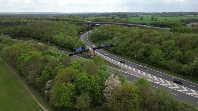 M1 M25 motorway UK Junction cars splitting in two directions drone aerial view