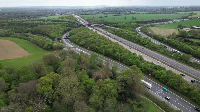 Panning drone aerial view M1 M25 motorway UK