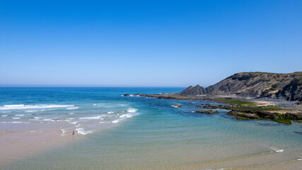 Fototapeta na wymiar Beautiful beach in portugal, travel concept. Blue ocean and seashore