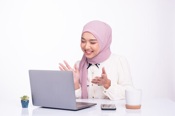 Young pretty muslim woman online meeting in room, education online, remote work freelancer.