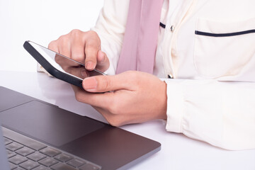 Woman with a finger on the screen using a mobile phone. Cropped image. 