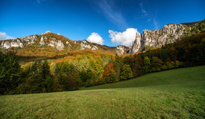 Colorful trees in autmn forest at Sulov rocks. Autumn mountain landscape in Slovakia