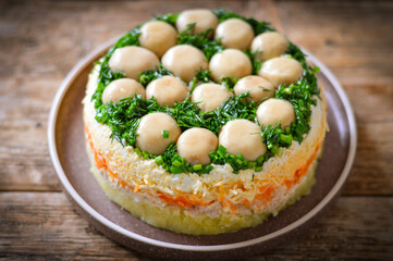 Layered salad with whole champignon mushrooms 