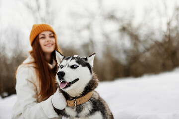 woman with a purebred dog on the snow walk play rest Lifestyle