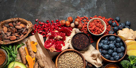 Healthy food clean eating selection on dark background.