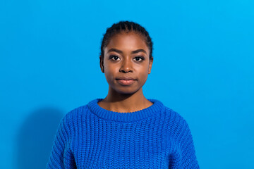 Photo of cheerful charming young woman wear sweater smiling isolated blue color background