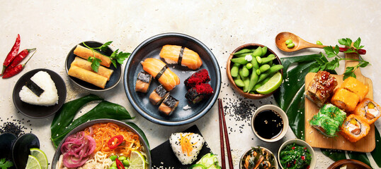 Japanese food assortment on light background.