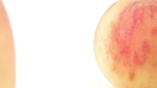 extremely close-up, detailed. ripe peaches on a white background