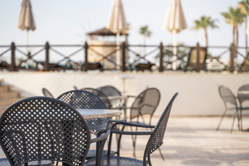 Open cafe by the pool in the morning.