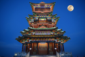 yongdingge tower and full moon at night 