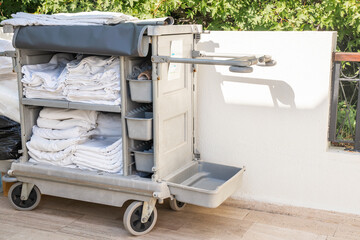 Cleaning trolley with cleaning equipment in outdoor hotel