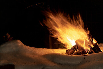 live fire on a winter night in windy weather