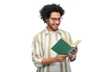 knowledge, education and people concept - happy smiling young man in glasses reading book over white background