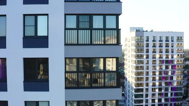 Top view of residential windows of modern house. Stock footage. Beautiful reflection of windows of modern residential building. Modern architecture design of residential building