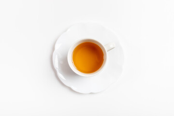 Cup of green tea isolated in center of white background.