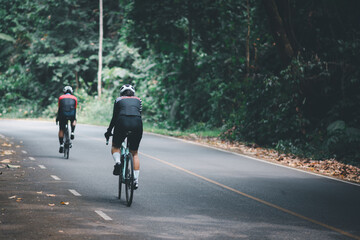 Women on road bikes exercise to stay healthy.