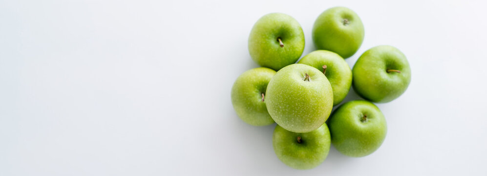top view of green and ripe apples on white, banner.