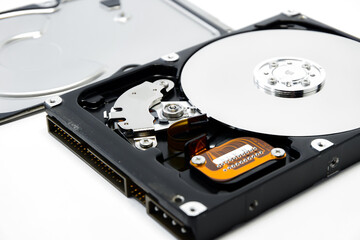 Open hard drive isolated on white background closeup. Computer hard drive HDD. computer memory