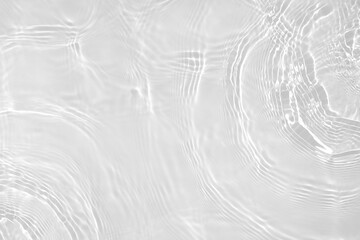 Obraz na płótnie Canvas Desaturated transparent clear water surface texture with ripples, splashes Abstract nature background. White-grey water waves overlay Copy space, top view. Cosmetic moisturizer micellar toner emulsion