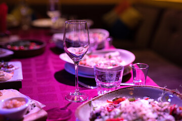 festive table with plates of food at the party