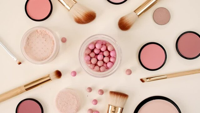 A set of decorative cosmetics on beige background. Makeup products. The beauty of the background with cosmetic facilities. Makeup, the concept of skin care with. High quality 4k footage