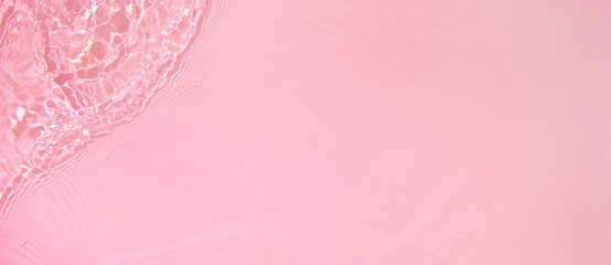 Abstract summer banner background Transparent pink clear water surface texture with ripples,...