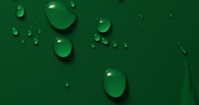 Abstract water drops on green background, macro, Bubbles close up, Cosmetic liquid drops, Flat lay pattern.