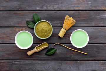 Tea ceremony with matcha powder and hot drink, top view