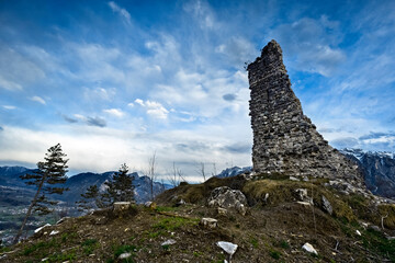 The medieval ruins of San Pietro castle stand out on the top of Mount Ciolino. Torcegno, Valsugana,...