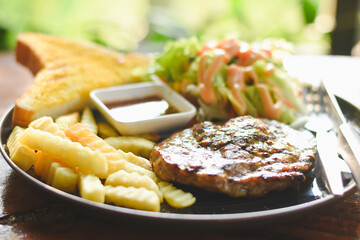 Pork neck steak on a plate ready to eat