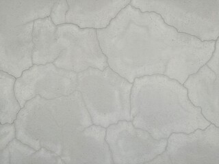 Gray cement wall with cracks and peeling of paint,grey concrete texture background.