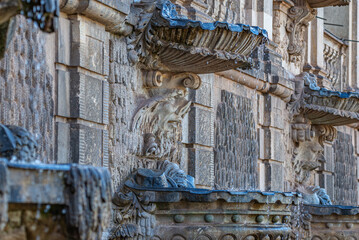 Fototapeta premium Ancient sculpture of funny, tricky and joyful dickens at fountains in historical downtown of Dresden, Germany, details, closeup. Concept of art and historical heritage.