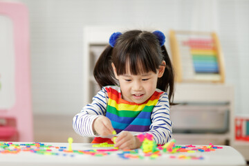 Fototapeta na wymiar young girl playing creative blocks for homeschooling