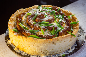 Spiral mitlof with potatoes baked into a pie