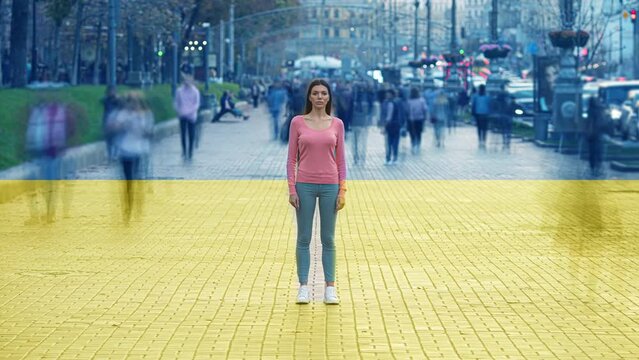 The woman stands on crowdy street on the ukrainian flag background. time lapse
