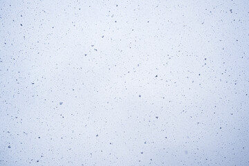 Snow on the background of the sky. Falling snow. 