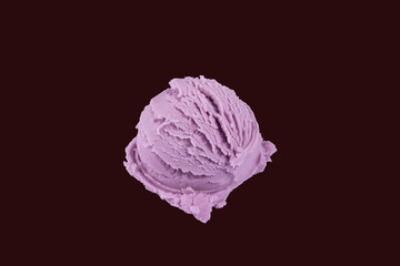 Purple color grape flavor ice cream isolated with red background. Ice cream ball.