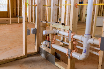 Home construction with hot red and cold blue pex pipe layout in new bathtub house PVC waste water system