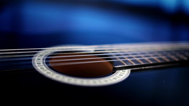Poetic focus passage on blue light guitar 