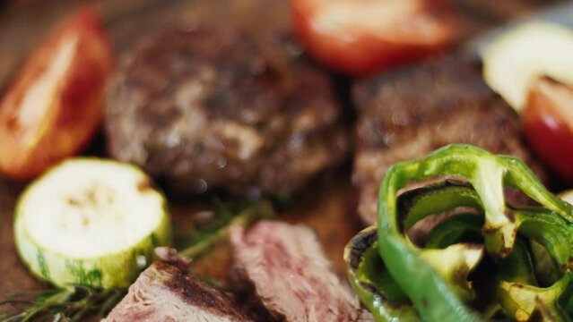 Filet mignon and vegetables on the table after cooking on the charcoal grill