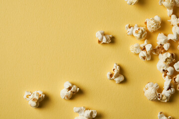 Popcorn on a yellow background.Copy space. Pop corn collection. Different sizes of popcorn